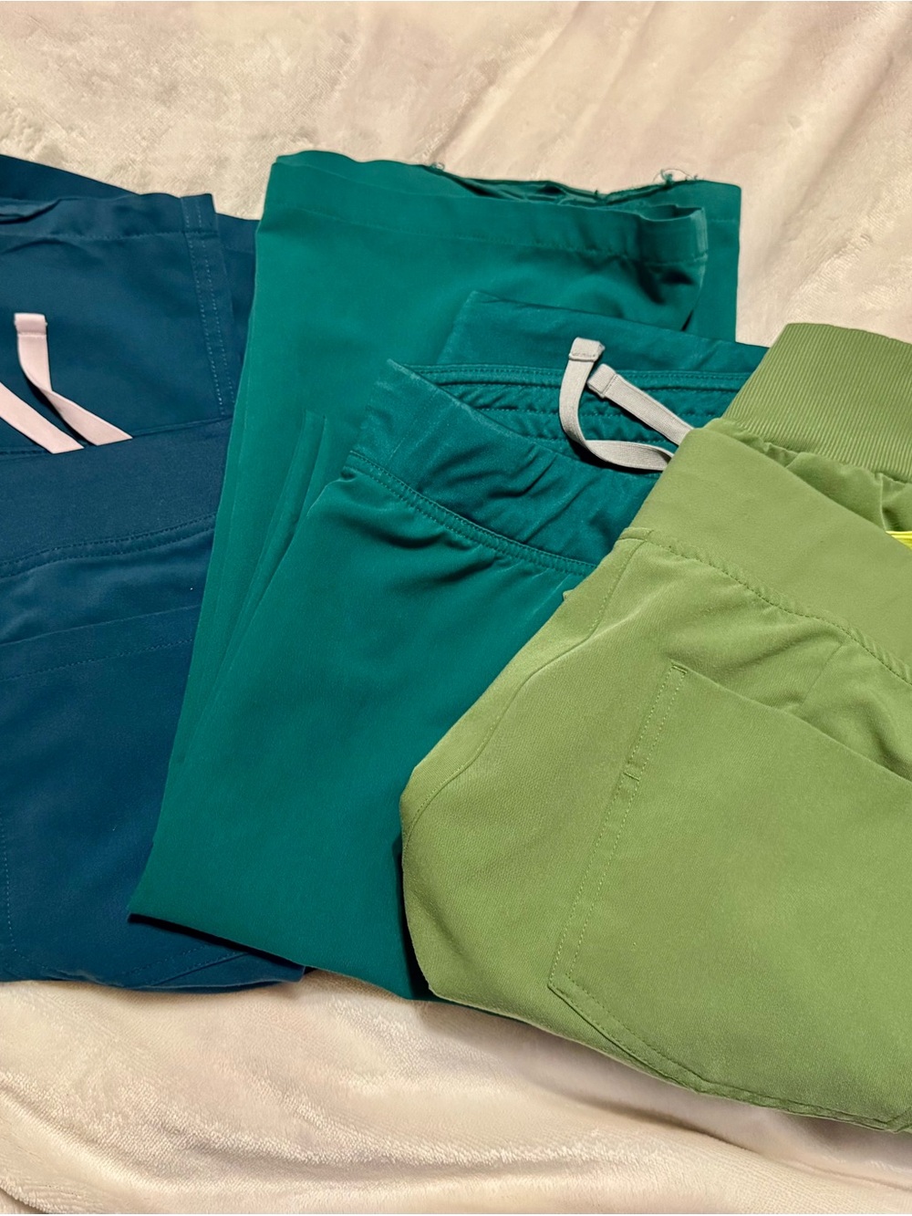 Figs brand. Women’s Deep Teal/hunter Green/bright green Scrub pants.